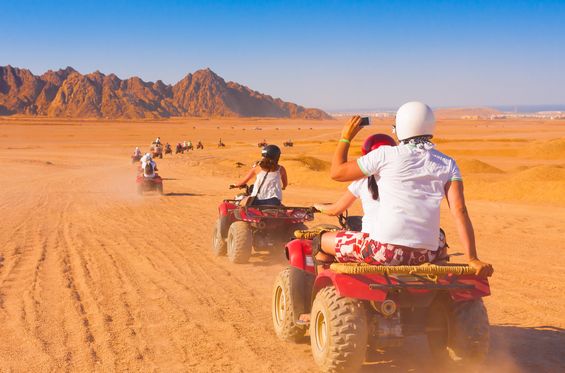 Driving a quad bike in the dunes