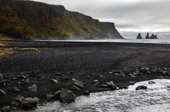 Walking on a black sand beach